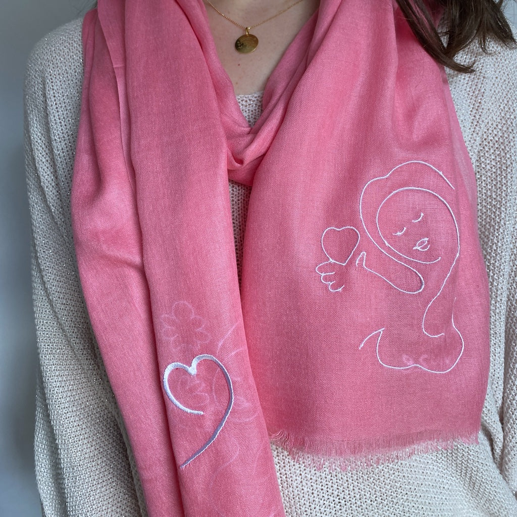 Muze pink lightweight scarf in modal and silk on model displaying embroidery of heart shape and love
