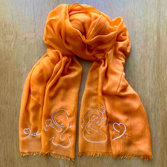 Muze orange lightweight scarf in modal and silk with embroidery of peace, love, heart and Muze logo drawings